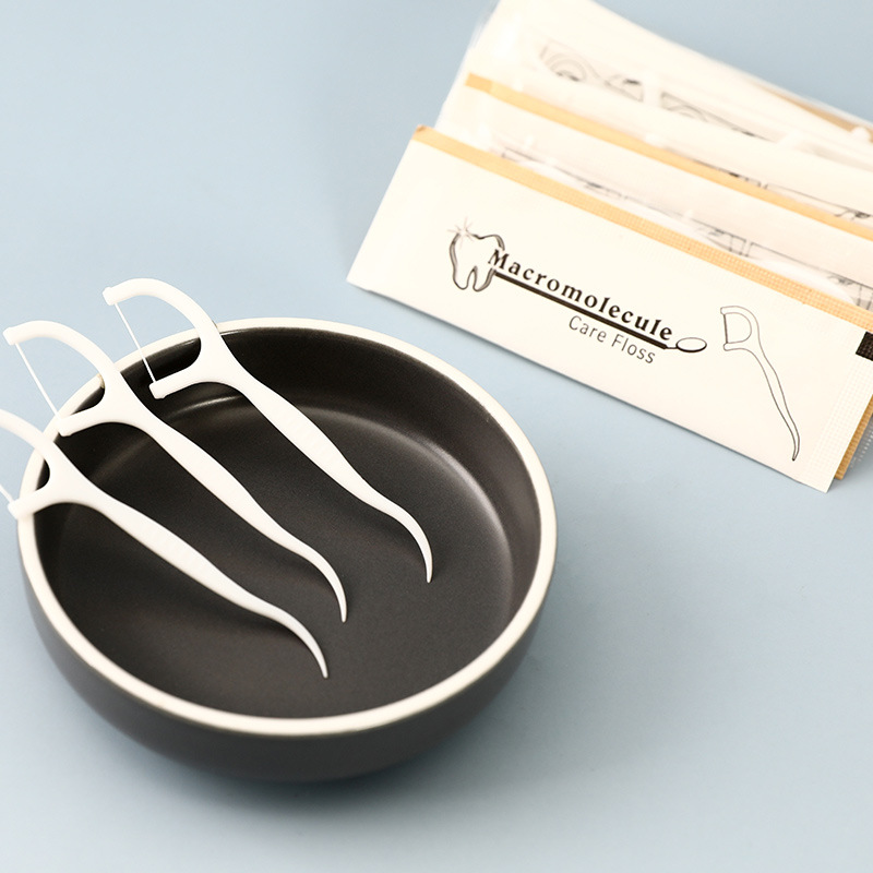 Dental floss individually packaged with custom logo